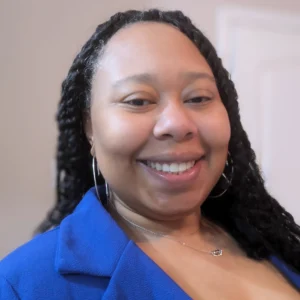 Portrait of Raenya Woodside-Howard, Education Specialist at Hey Coach Rae Educational Services, speaker at the Educators Assemble™ Conference.