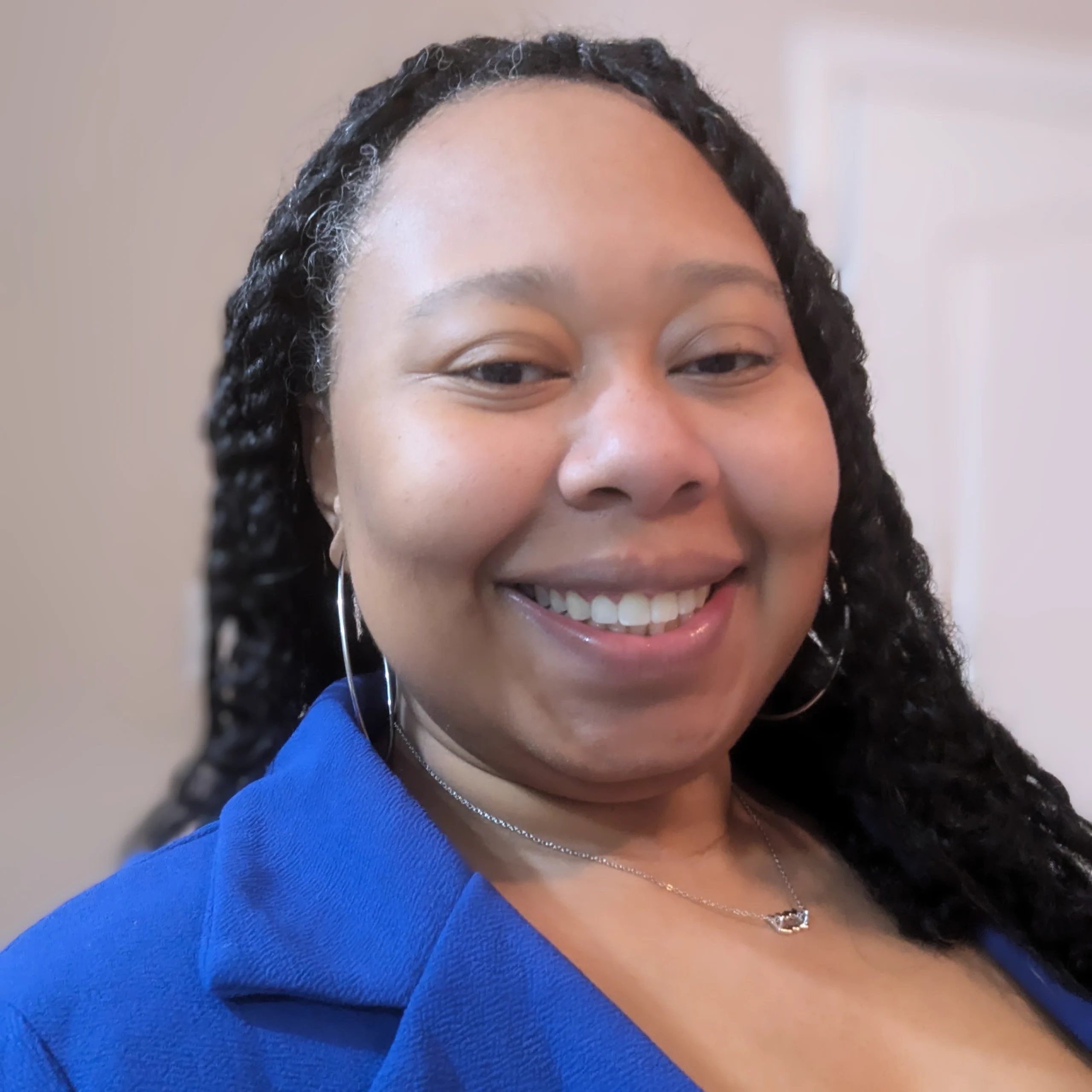 Portrait of Raenya Woodside-Howard, Education Specialist at Hey Coach Rae Educational Services, speaker at the Educators Assemble™ Conference.