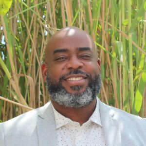 Portrait of Sylvester Johnson, Senior Capital Access Manager at Propeller, smiling warmly. Speaker at the Educators Assemble™ Conference.