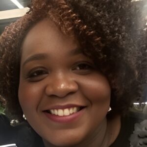 Smiling portrait of Jerwanna Clay, LCSW-BACS. Speaker at the Educators Assemble™ Conference.